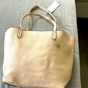 Beautiful brand new large and small beige purse pair. Never used per the tags.